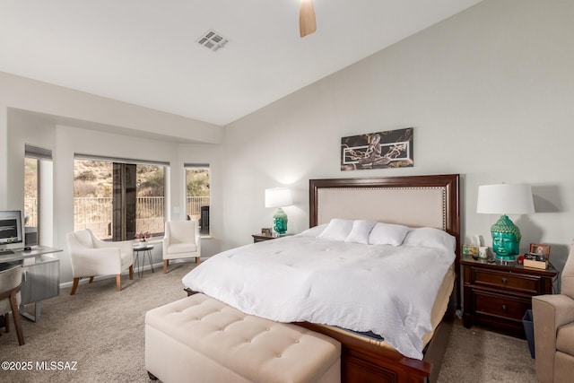 carpeted bedroom featuring vaulted ceiling and ceiling fan