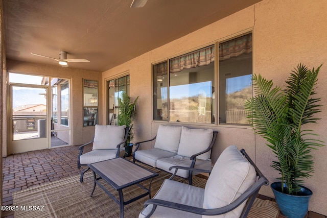 view of patio featuring ceiling fan and outdoor lounge area