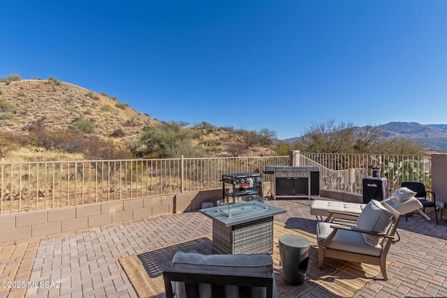 view of patio / terrace with a mountain view