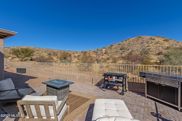 view of patio / terrace featuring a mountain view