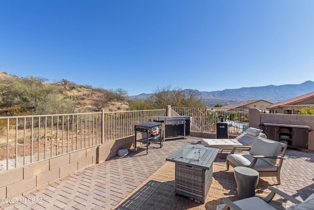 view of patio featuring grilling area and a mountain view