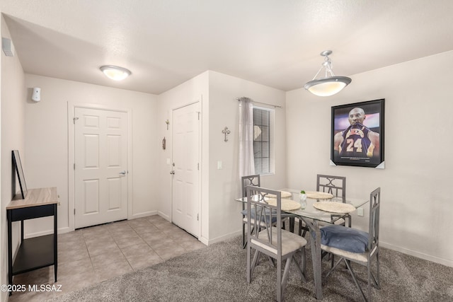 dining space with light carpet