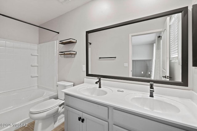 full bathroom with shower / bathtub combination, vanity, toilet, and wood-type flooring