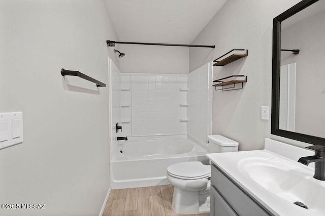 full bathroom with hardwood / wood-style flooring, vanity, toilet, and shower / tub combination