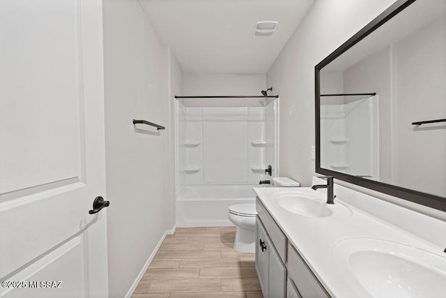 full bathroom with  shower combination, vanity, and toilet