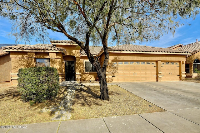 mediterranean / spanish house with a garage