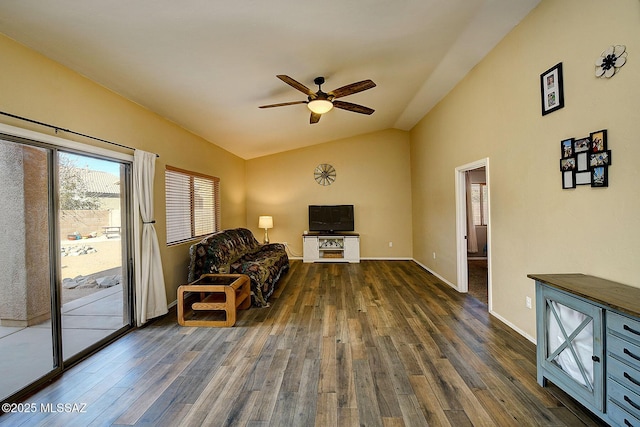 living area with lofted ceiling, dark hardwood / wood-style floors, and ceiling fan