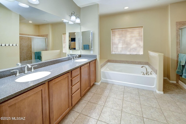 bathroom featuring vanity, separate shower and tub, and tile patterned floors