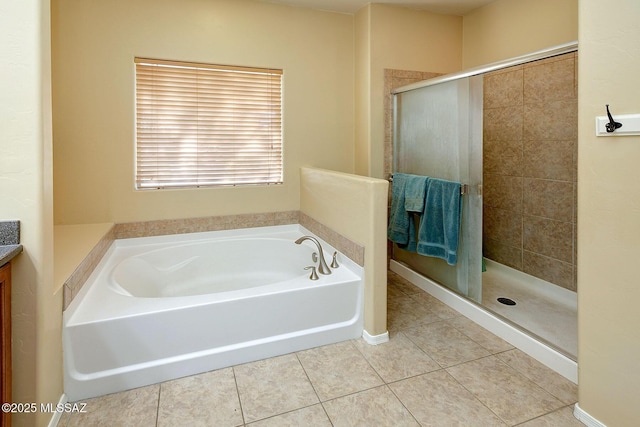 bathroom with vanity, shower with separate bathtub, and tile patterned floors