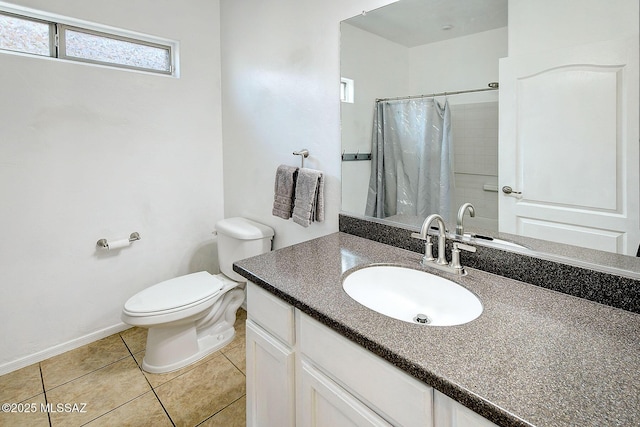 bathroom featuring tile patterned flooring, vanity, a shower with shower curtain, and toilet