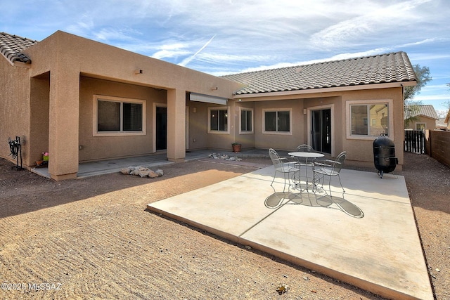 back of property with a patio area