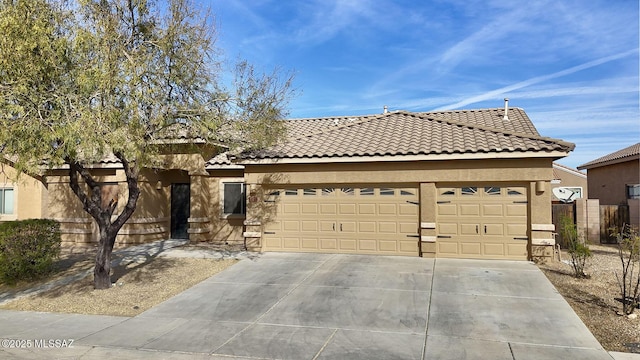 view of front of property with a garage