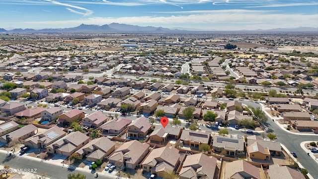 birds eye view of property with a mountain view