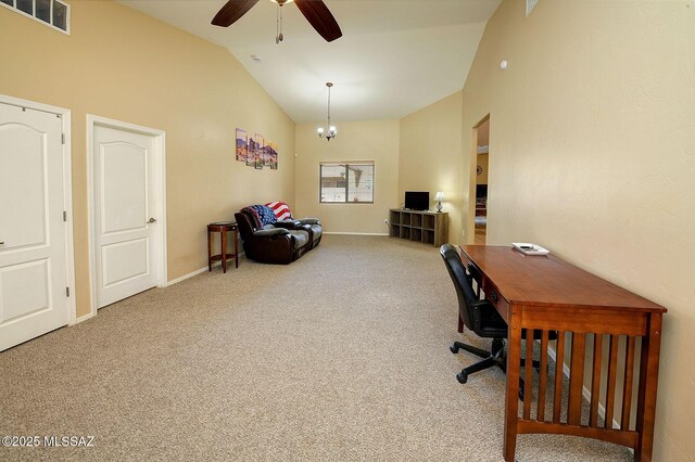 office space featuring carpet floors, ceiling fan with notable chandelier, and high vaulted ceiling