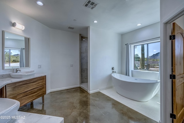 bathroom with concrete flooring, vanity, and independent shower and bath