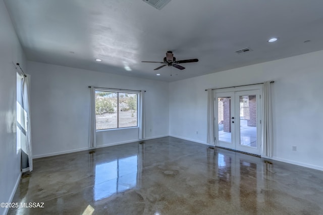 spare room featuring french doors and ceiling fan