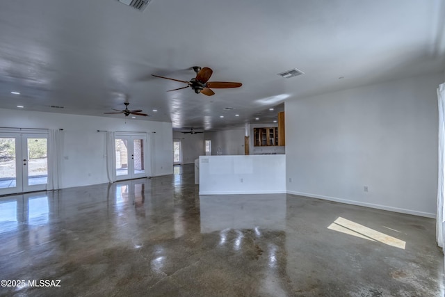 unfurnished living room featuring french doors