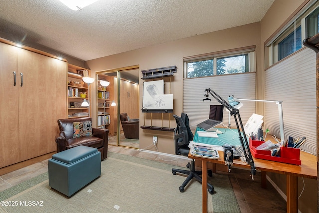 office space with a textured ceiling