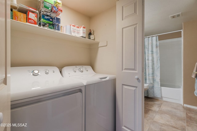 laundry room featuring laundry area, independent washer and dryer, and visible vents