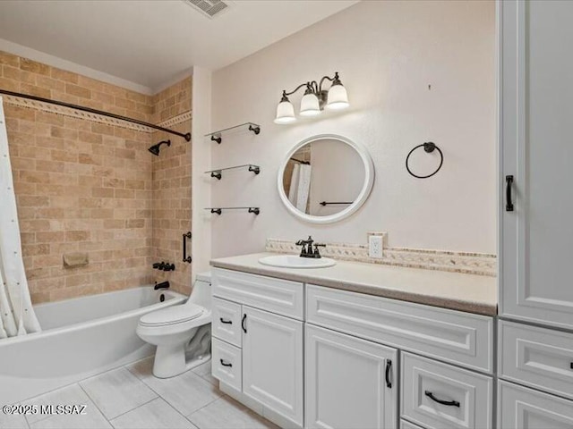 full bathroom featuring vanity, tile patterned flooring, toilet, and shower / bath combo with shower curtain