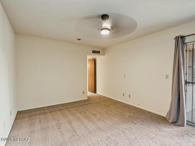 unfurnished room featuring carpet flooring and ceiling fan