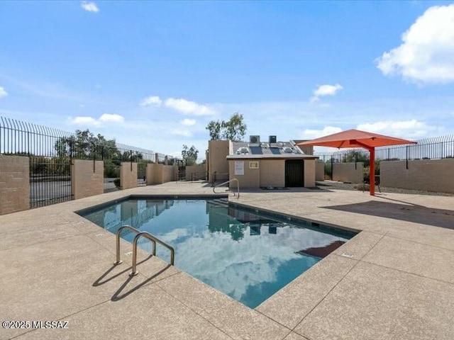 view of swimming pool featuring a patio area