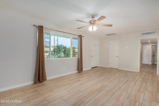 empty room featuring ceiling fan