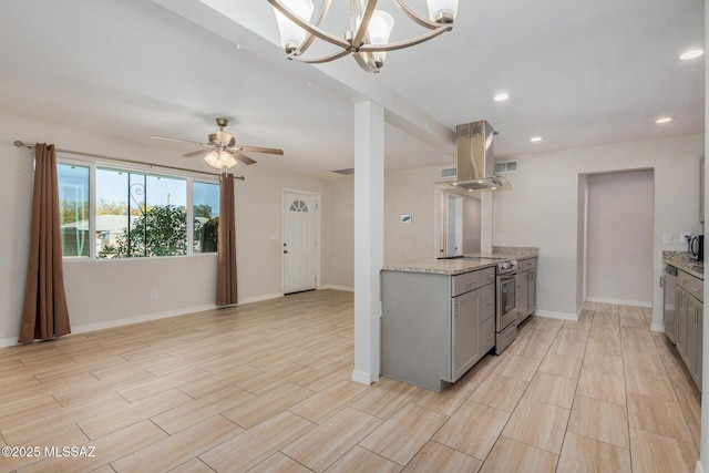 kitchen featuring stainless steel electric range oven, island exhaust hood, gray cabinetry, and light stone counters