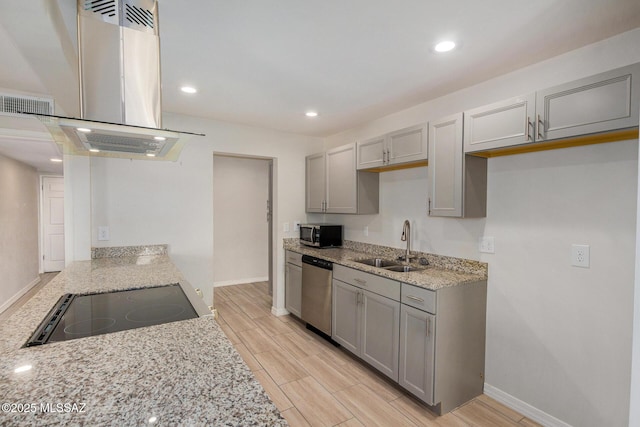 kitchen featuring island range hood, sink, gray cabinetry, light stone counters, and stainless steel appliances