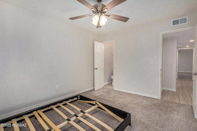 unfurnished bedroom with ceiling fan and carpet flooring