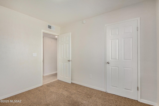 unfurnished bedroom with light carpet