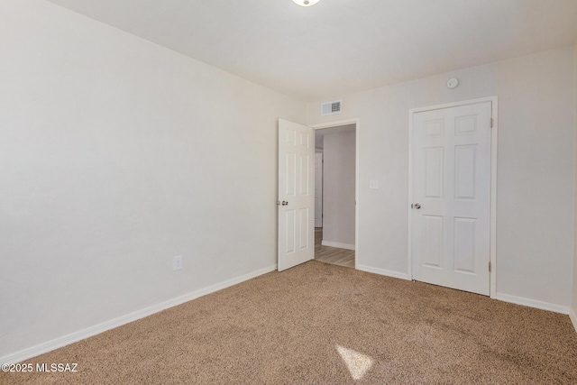 unfurnished bedroom featuring carpet