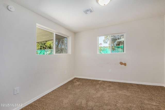 empty room featuring carpet floors