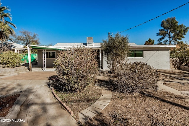 view of front of property with a carport