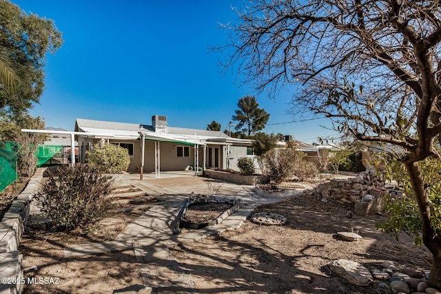 rear view of house with a patio