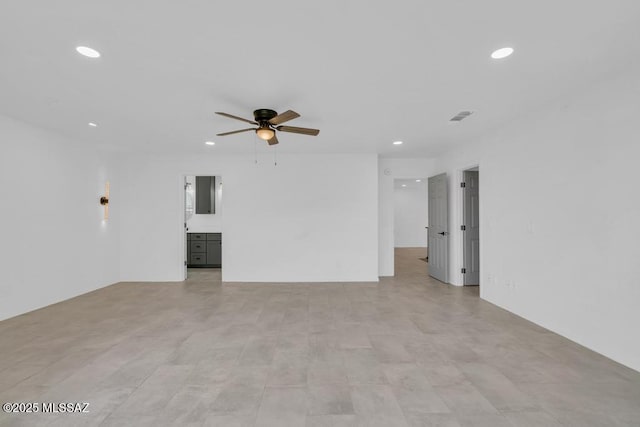 unfurnished living room with ceiling fan