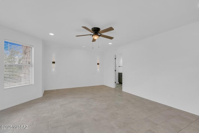 spare room with ceiling fan