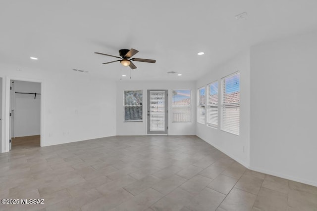 spare room with ceiling fan