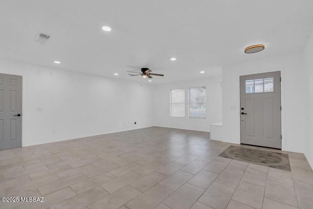 entryway featuring ceiling fan