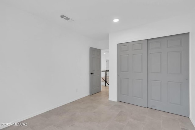 unfurnished bedroom with a closet