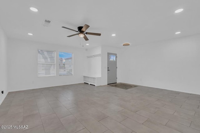 spare room with ceiling fan