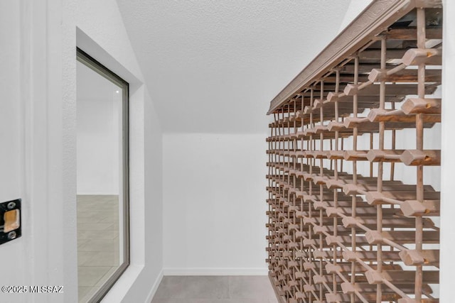 wine room featuring a textured ceiling