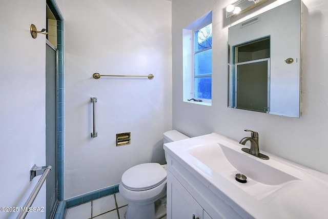 full bath with toilet, a shower with shower door, tile patterned flooring, and vanity