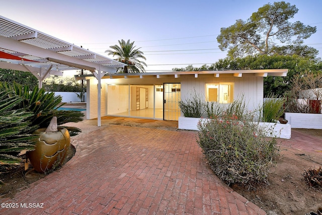 exterior space featuring a pergola and a patio