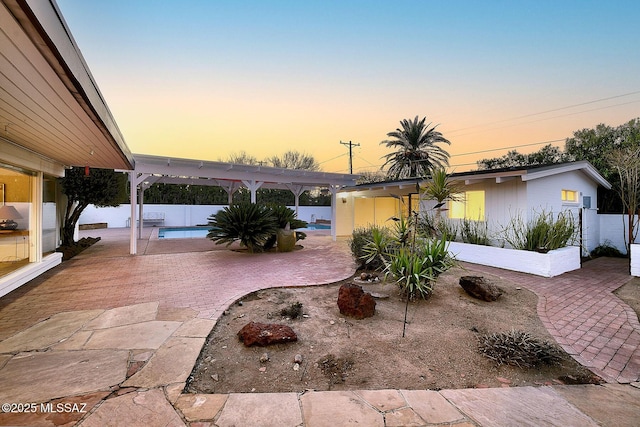 exterior space featuring a fenced in pool, fence, and a pergola