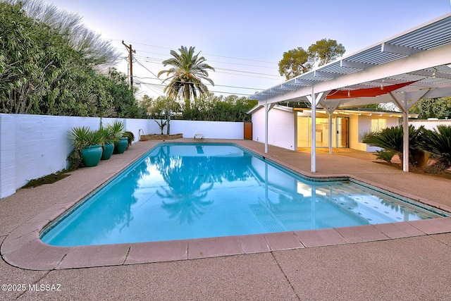 view of pool featuring a patio area, a fenced backyard, a fenced in pool, and a pergola