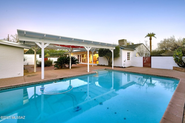 view of pool with a patio area, fence, a fenced in pool, and a pergola