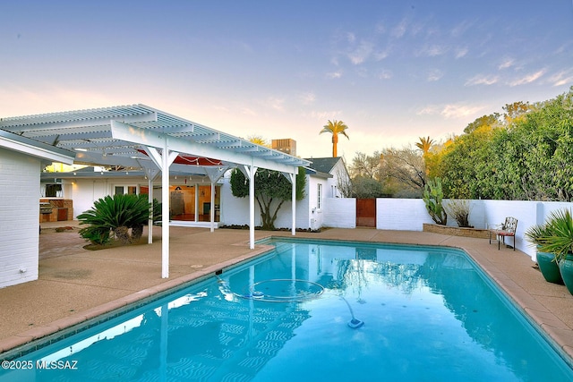 view of pool featuring a patio area, a fenced in pool, fence, and a pergola