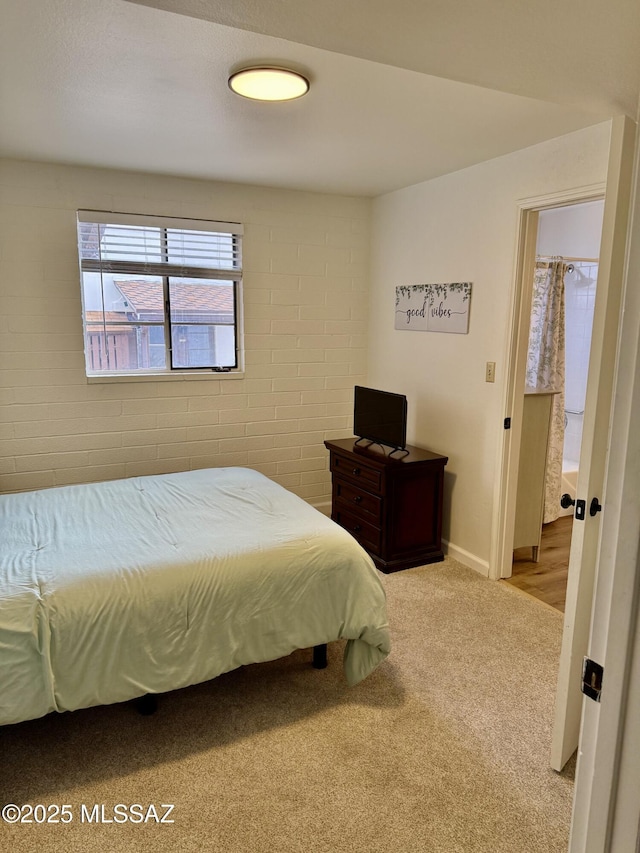 bedroom featuring baseboards and carpet floors