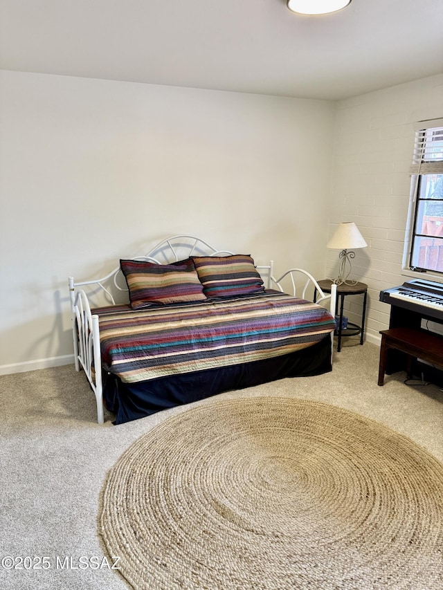 carpeted bedroom with baseboards